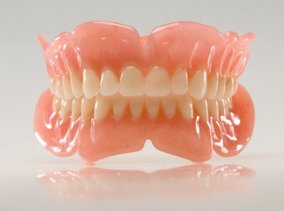 A photo of a full set of newly constructed dentures.
